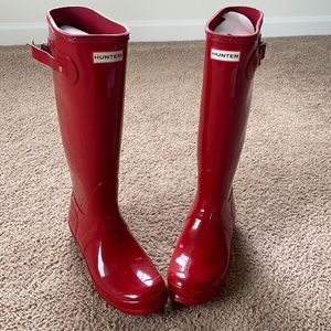 Hunter brand military red high gloss rain boots.